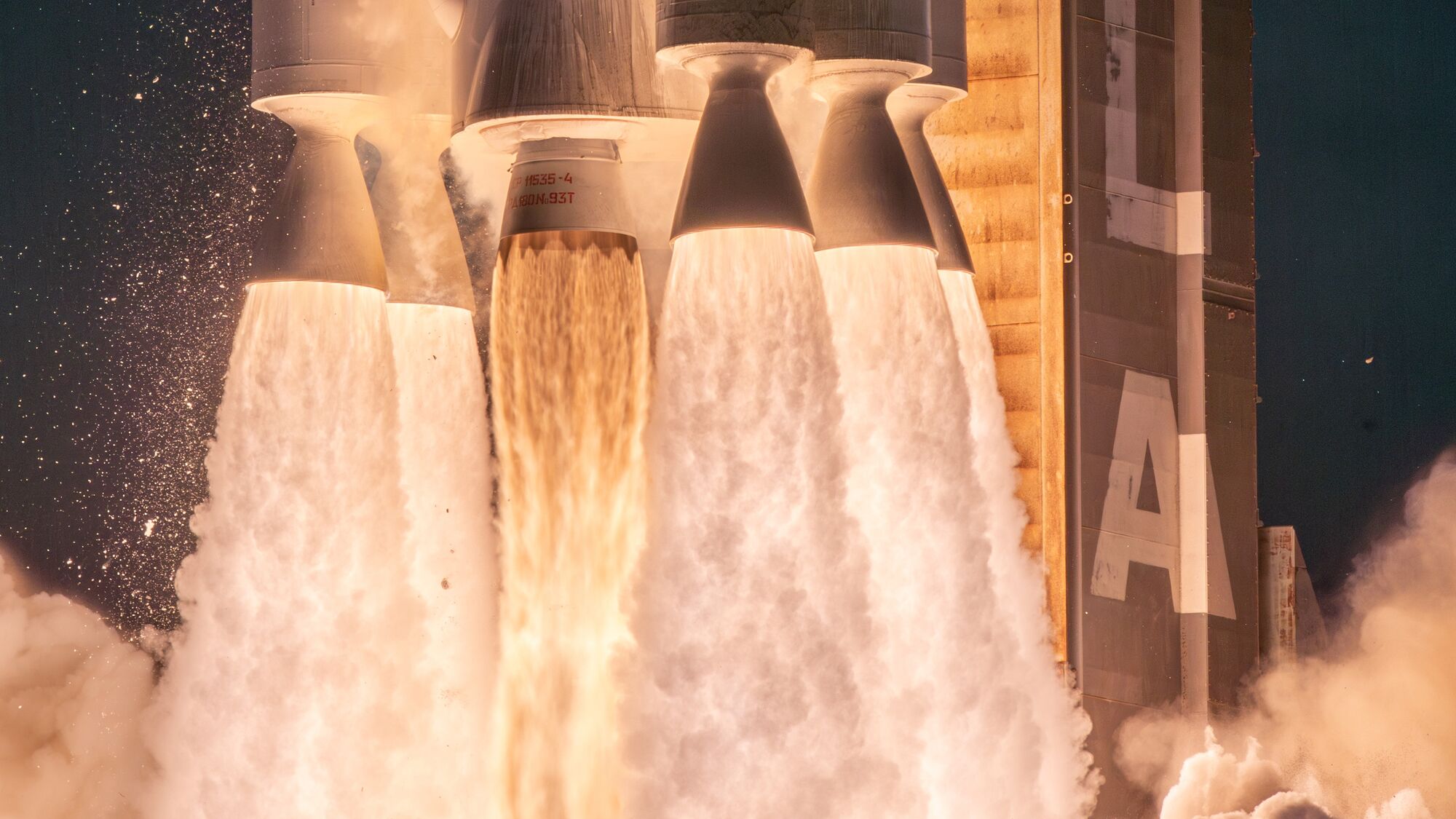 Close-up of rocket thrusters during liftoff