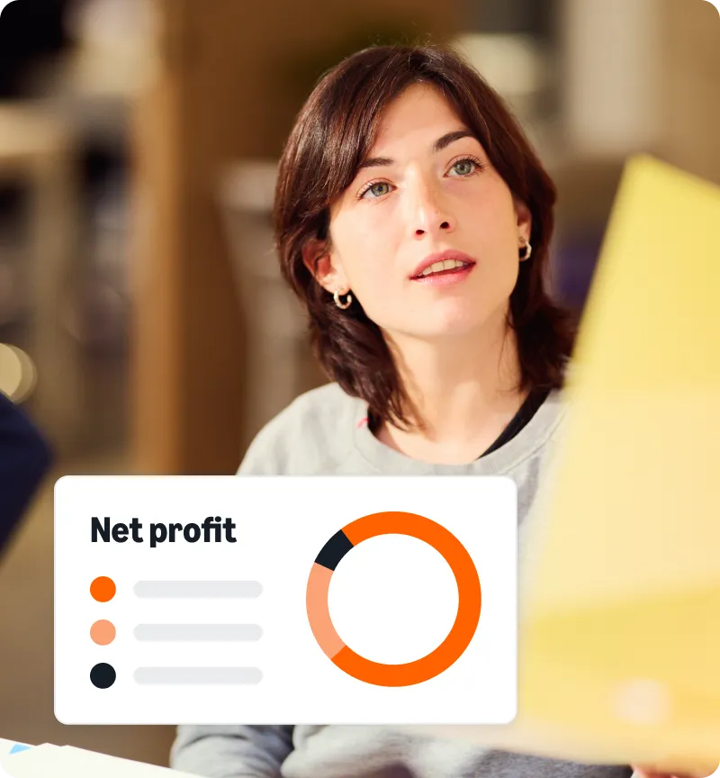A woman looking at a net profit graph